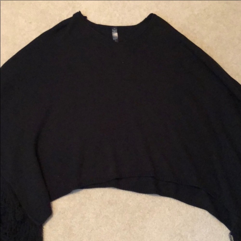 Knit poncho with fringe and v neck